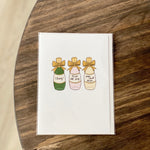 Champagne Bottles Greeting Card